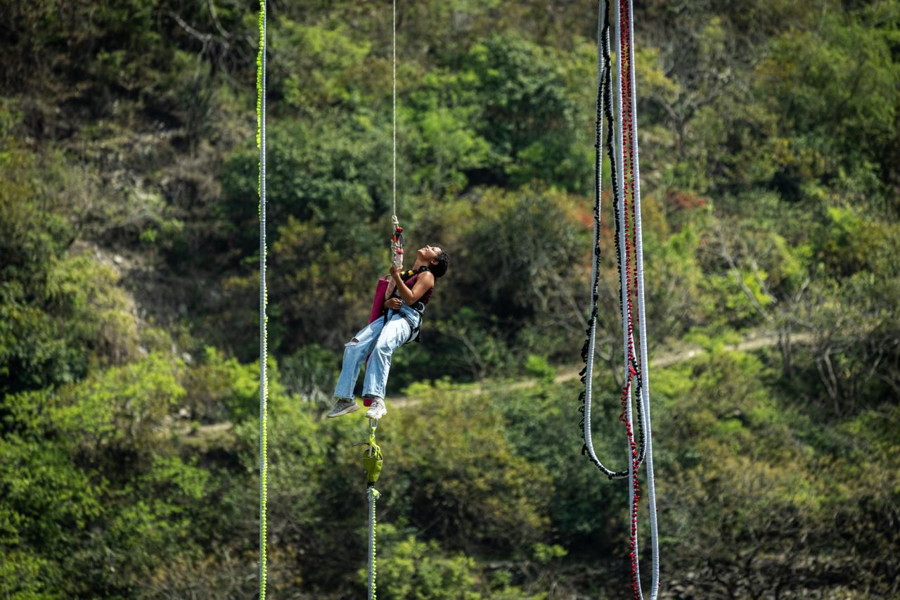Bungy jumper in free fall above the Ganga at Devprayag